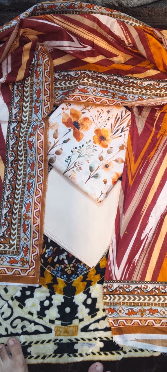 03-piece gold  Unstitched  light orange  chamki print lawn suit